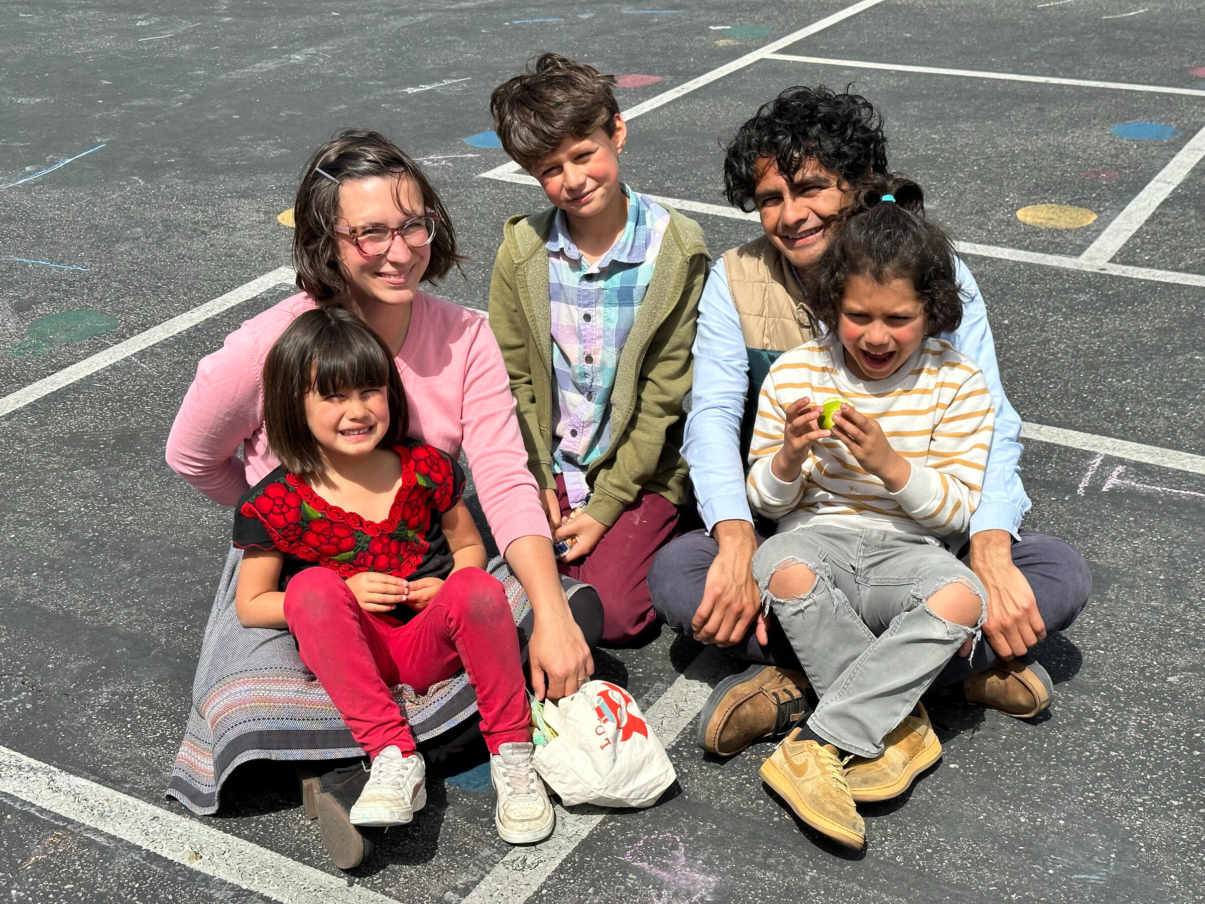 Marisa Gomez dropping off her three kids at school, wearing and carrying face masks