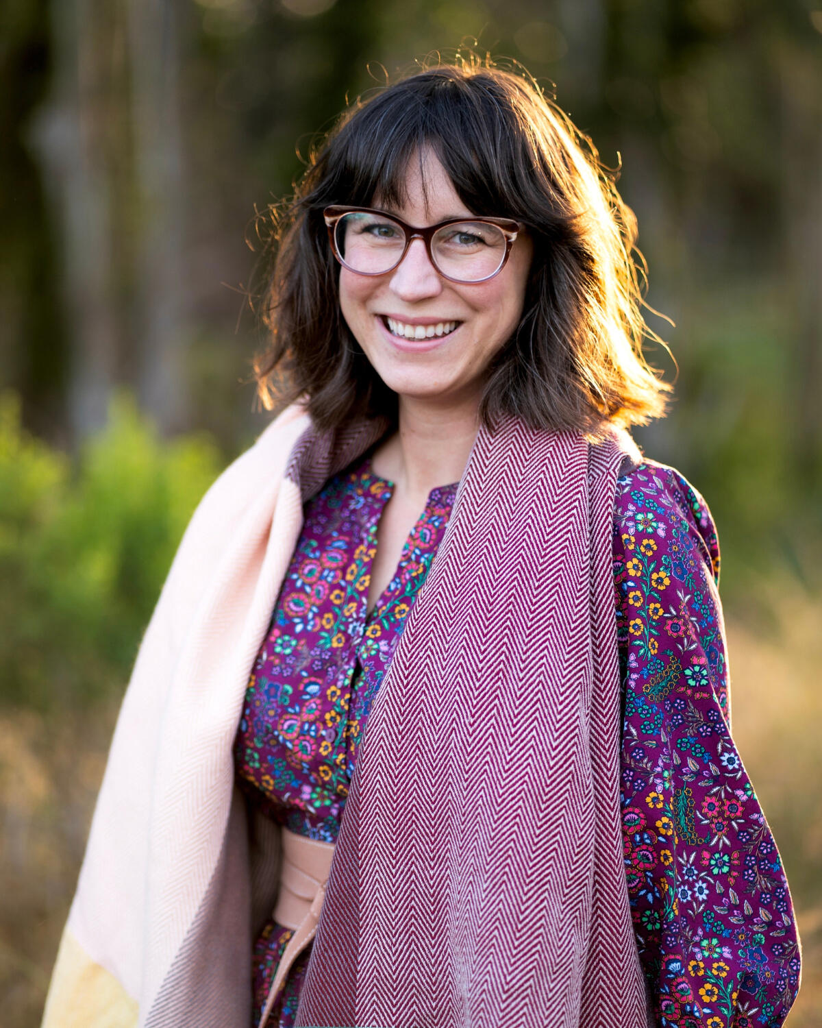 Backlit Portrait of Candidate Marisa Gomez, smiling at the camera