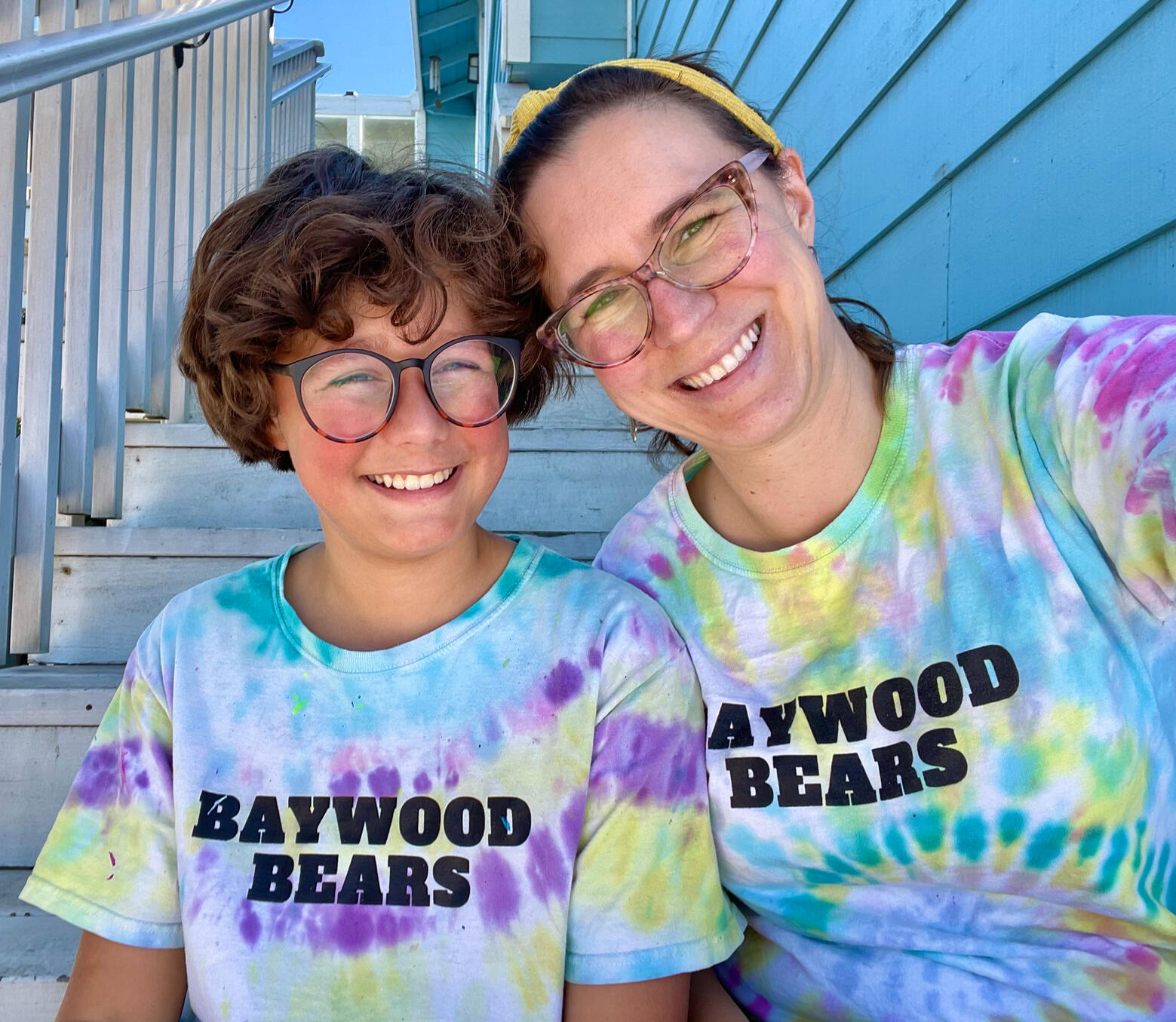 A knot, intertwining two colored strands, is the logo for Marisa Gomez For School Board 2026